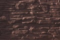 Pattern from lite brown decorative slate stone brick wall surface. panorama of brown stone wall texture background Royalty Free Stock Photo