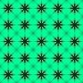 Pattern of luminous repetitive dark snowflakes on a green background