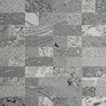 A pattern made of granite tiles in various shades of gray. The tiles are rectangular and Royalty Free Stock Photo