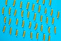 Pattern made of pasta on blue background. Flat lay