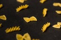 Pattern made of pasta on dark background. Royalty Free Stock Photo