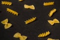 Pattern made of pasta on dark background. Royalty Free Stock Photo