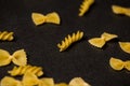 Pattern made of pasta on dark background. Royalty Free Stock Photo