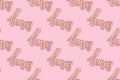 Pattern made of Word Love. Foil inflatable balloon on a pink background. Royalty Free Stock Photo