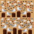 A pattern of many white sea gulls sitting on a wooden breakwater surrounded by sea pebbles and rocks. Royalty Free Stock Photo