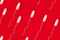 Pattern medical female tampon on a red background. Hygienic white tampon for women. Cotton swab. Menstruation means of protection