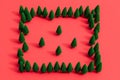 Pattern of miniature-pine trees on a red-background. Royalty Free Stock Photo