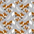 Seamless vector pattern with cute hand drawn foxes and leaves. Royalty Free Stock Photo