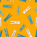 Pattern multicolored clothespins on a yellow