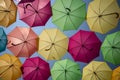 Pattern of multiple colored umbrellas in random order.