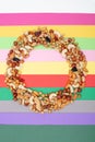 Pattern of nuts in circle form. Various nuts on colorful paper Royalty Free Stock Photo