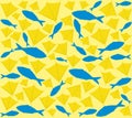 Pattern of ocean fish and gull flippers. The legs of yellow gulls are mixed with blue fish on a background of light yellow sand Royalty Free Stock Photo