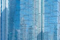 Pattern of office buildings windows. Glass architecture facade design with reflection in urban city, Downtown Dubai. Urban city in