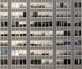 Pattern of office facade with windows and shutter blinds