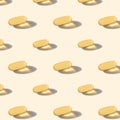 A pattern of omega capsules on a beige background.