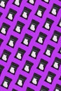 Pattern of an open pack of hand and body wet wipes on purple background. A black packet of wet wipes Royalty Free Stock Photo