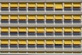 Pattern of orange shutter sun protection at a facade of a modern concrete building Royalty Free Stock Photo