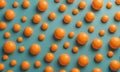 pattern orange spheres arranged in grid-like fashion against light blue background. Royalty Free Stock Photo