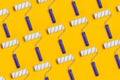 Pattern with paint roller with blue handle on yellow background. Clean roll for painting walls Royalty Free Stock Photo