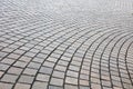 Pattern of paved cobble stones on a curve path