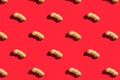 Pattern of peanuts with shell. Fashionable sunny pattern of peanuts with shell on a bright red background. Colorful pattern. View Royalty Free Stock Photo