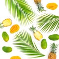 Pattern of pineapple and mango fruits with palm leaves on white background. Flat lay, top view. Tropical concept. Royalty Free Stock Photo
