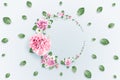 Pattern of pink and beige roses and green leaves on a white background. flat lay, top view, Mixed media. Spring background,