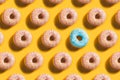 Doughnut Pattern with blue accent on yellow background Royalty Free Stock Photo