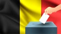 Male hand puts down a white sheet of paper with a mark as a symbol of a ballot paper against the background of the Belgium flag, B
