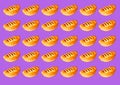 Pattern of puff buns with jam on a purple background Royalty Free Stock Photo