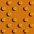 Pattern, pumkins on orange background with emty space