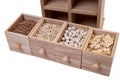 Pattern of raw cereals, beans and seeds, top view texture, mix of groats in square wooden box. Small wooden box with cells with Royalty Free Stock Photo