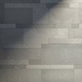 A pattern of rectangular, grey concrete tiles arranged in a staggered manner. The tiles Royalty Free Stock Photo