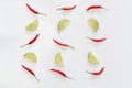 Pattern of red hot chili peppers and sliced limes on a white background. Royalty Free Stock Photo