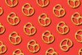 pattern with salty traditional pretzels on red background