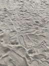 Pattern of sand with trampled footprints from boots on the beach Royalty Free Stock Photo