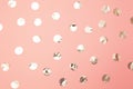 Pattern of shiny silver confetti on pastel millennial pink paper background. Concept of holiday, birthday, blogging, beauty.