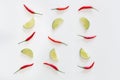Pattern of sliced limes and red thai hot chili peppers on a white background. Top view Royalty Free Stock Photo