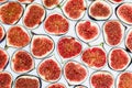 Pattern of sliced ripe figs isolated on white background. Fruit illustration. Food photo. Flat lay, Top view.