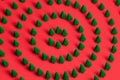 Pattern of miniature-pine trees on a red-background. Royalty Free Stock Photo