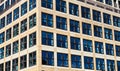 Pattern of square windows, made of squares, on a square modern building. Quadrangle shape of contemporary fenestra or casement