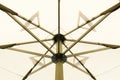 The pattern of steel frame umbrella underside detail with white cloth roof Royalty Free Stock Photo