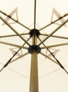 The pattern of steel frame umbrella underside detail with white cloth roof Royalty Free Stock Photo