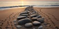 Pattern of stones on a sandy beach