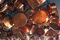 A pattern of stylish traditional shiny polished copper kitchen pans and pots Royalty Free Stock Photo
