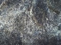 the pattern of the surface of the stone is grayish black