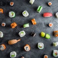 Pattern of sushi rolls on a dark background. Japanese food. Flat lay. Top view Royalty Free Stock Photo