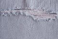 Pattern of tear and old on denim trousers, detail jeans texture for background Royalty Free Stock Photo