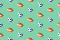 Pattern texture made of soccer and american football balls abstract on pastel green