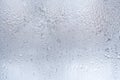 Thawed frosty drawing on the winter window as background or wallpaper.